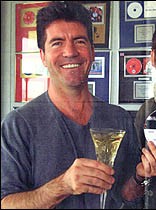 simon-with-champagne-in-office.jpg